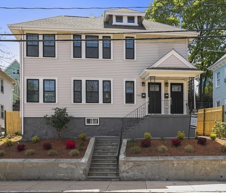 Lavish woodwork and a chef-inspired kitchen; Just two of the many exquisite features that distinguish this 2022 renovation of a two-family located steps to Roslindale Village.